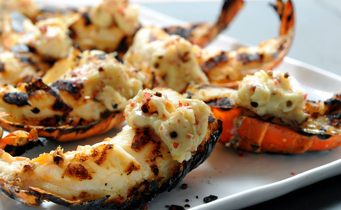 Grilled Lobster Tails with Ginger Grapefruit and Pink Peppercorn Butter