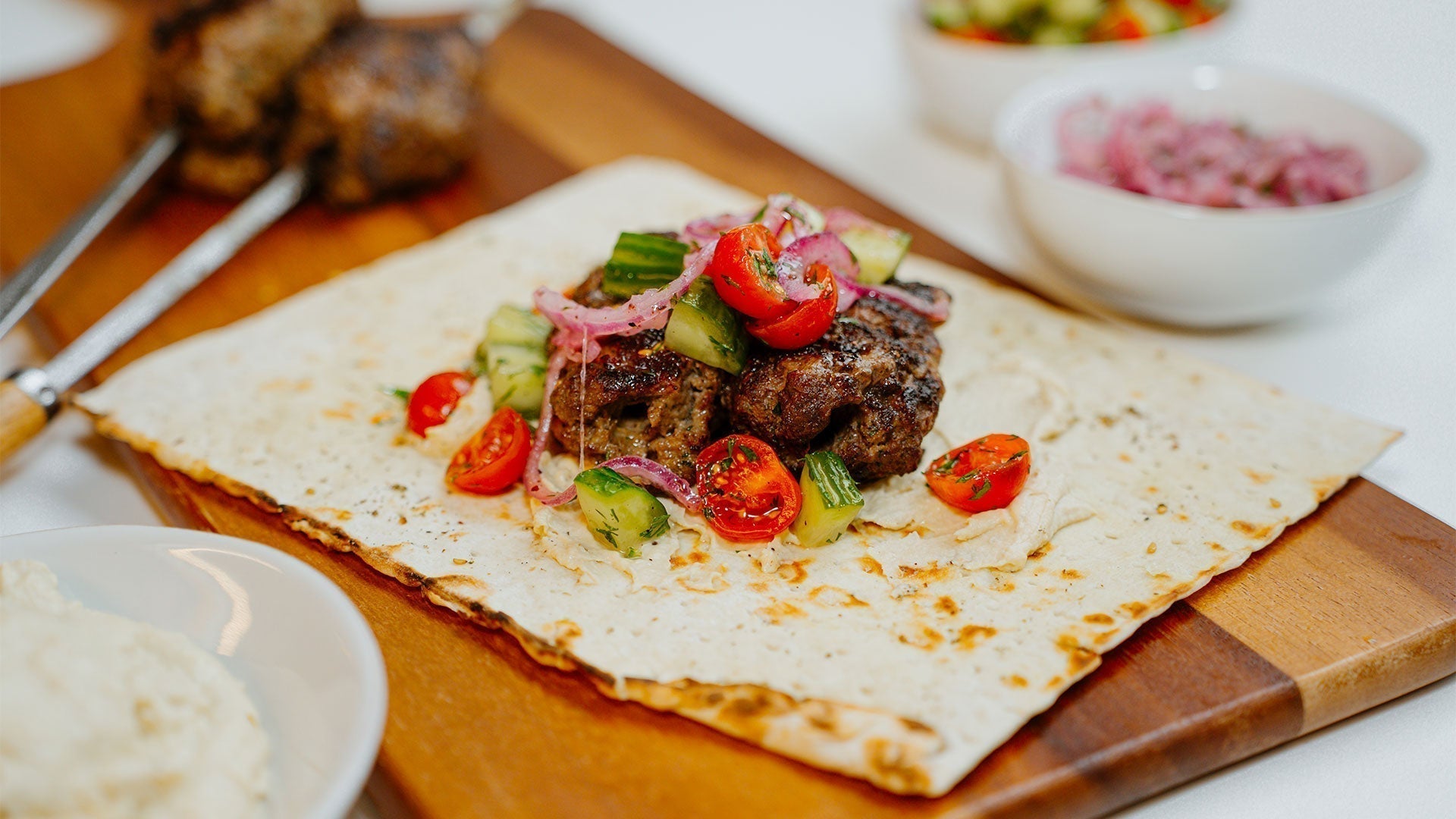 Turkish Kofte Kebab with Green Tahini and Tomato Cucumber Relish