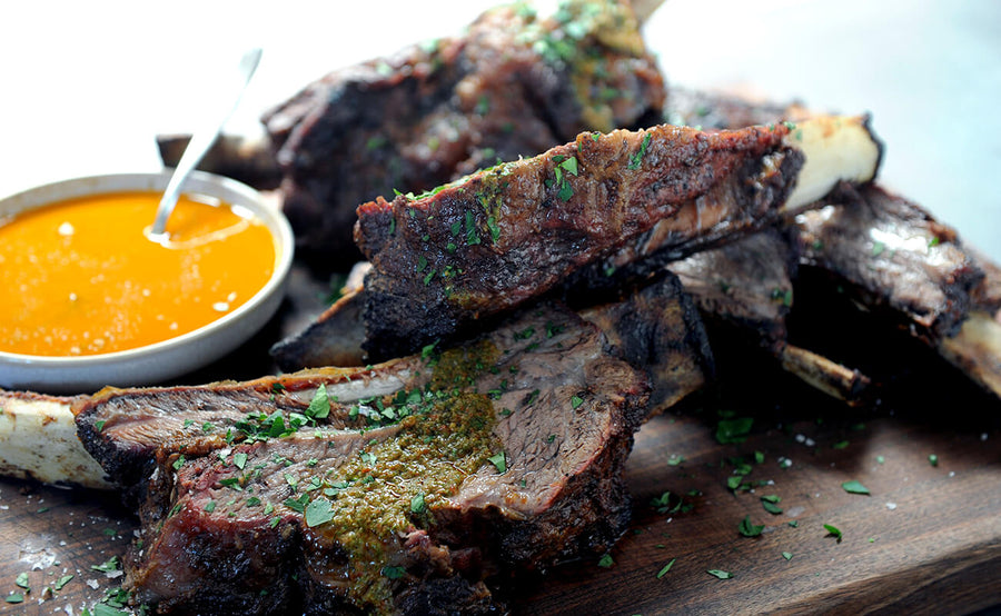 Wood-fired Rotisserie Beef Ribs with Smoky Red Chimichurri