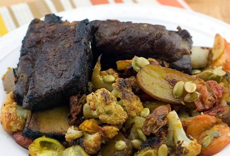 Beer-Braised Short Ribs with Roasted Cauliflower, Potatoes and Pumpkin Seeds