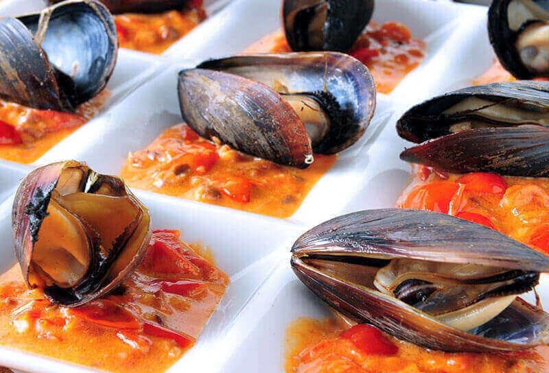 Wood-Fired Mussels with Rustic Olive and Tomato Sauce