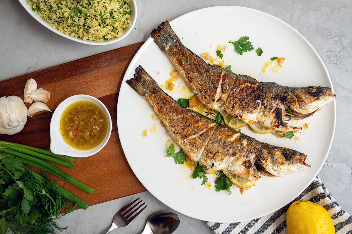 Image of Whole Grilled Branzino with Preserved Lemon Vinaigrette and Couscous Tabouli